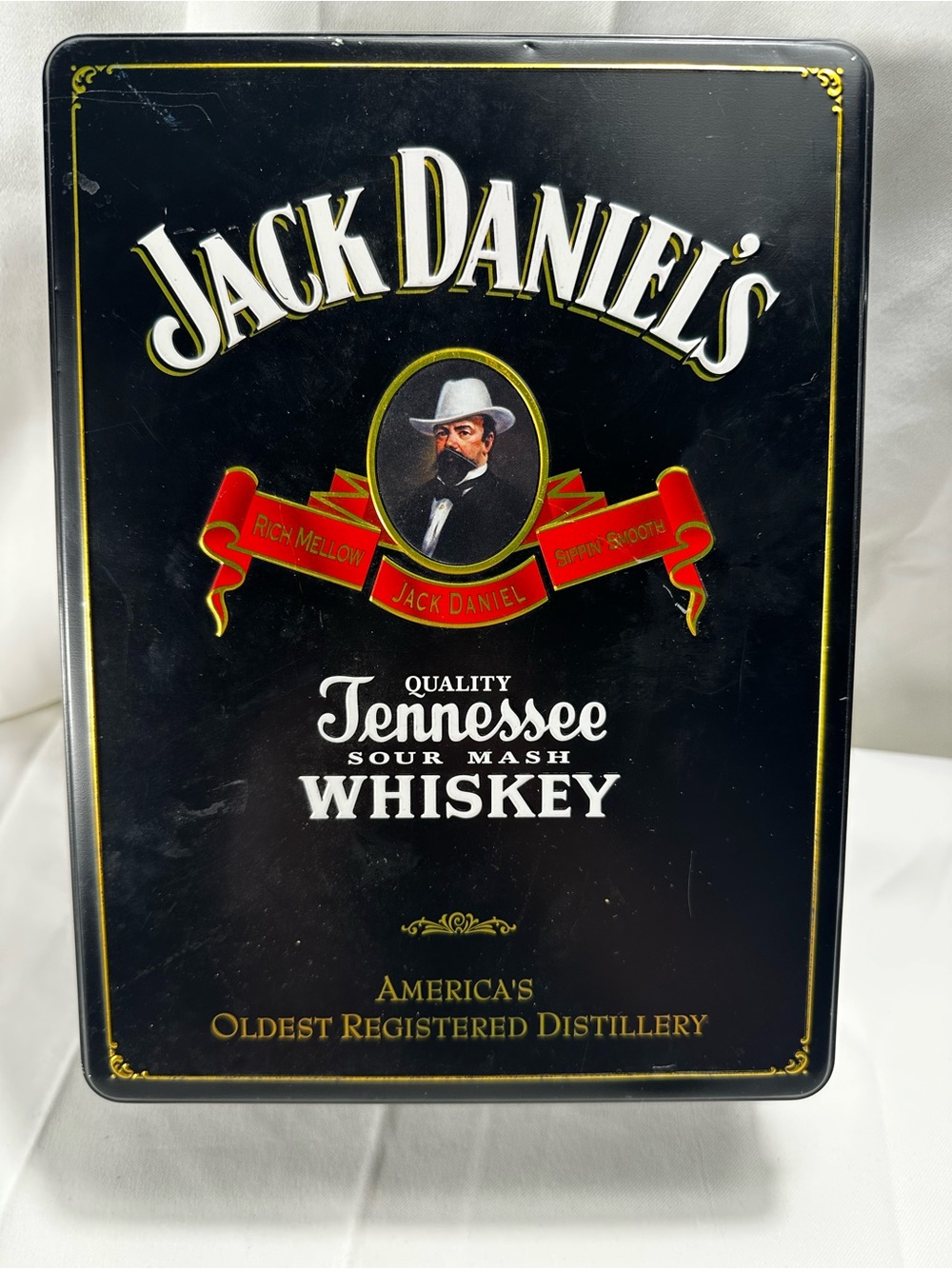 C7. Jack Daniel's Tennessee Whiskey Tin - Black with Red & Gold Accents